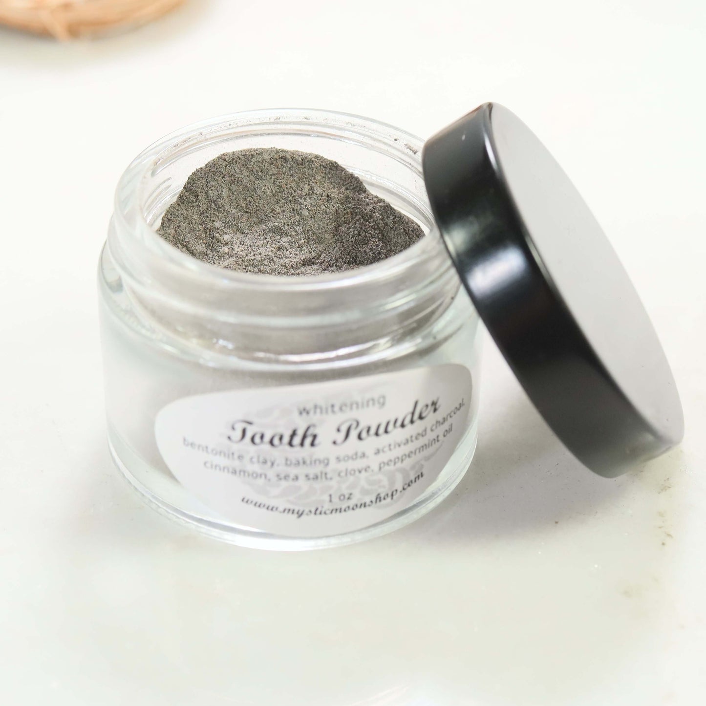 whitening tooth powder open jar