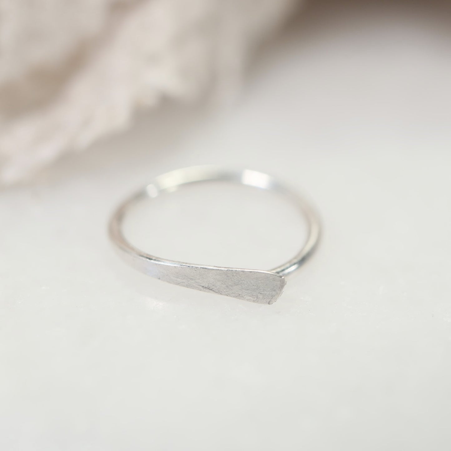 silver hoop earrings on white background