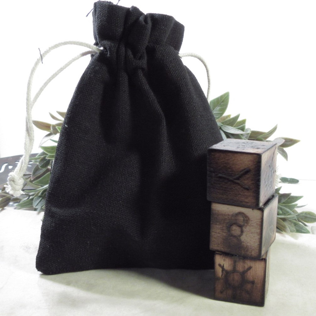 cloth bag and symbol runes dice on a white background