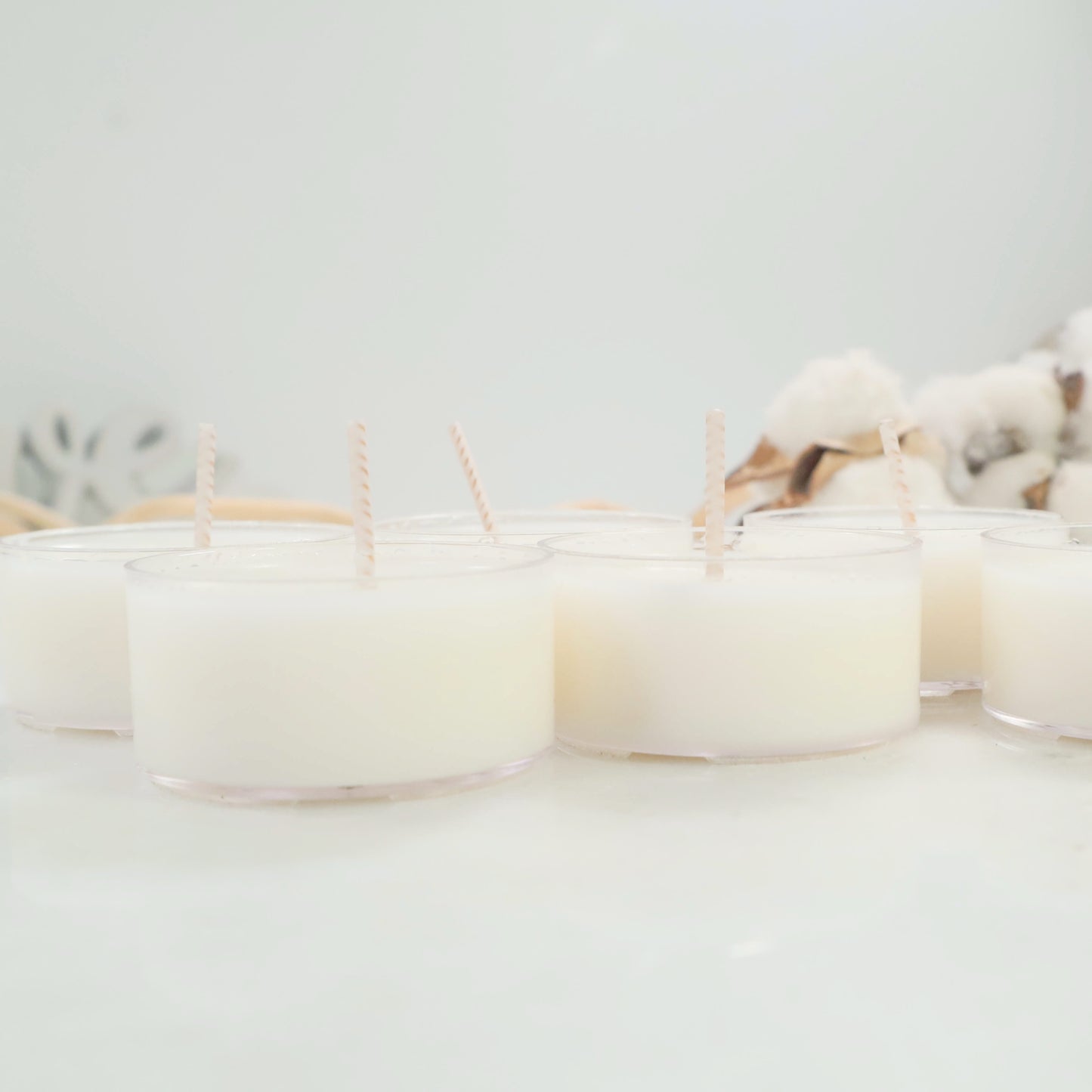 side of plain tea light candles