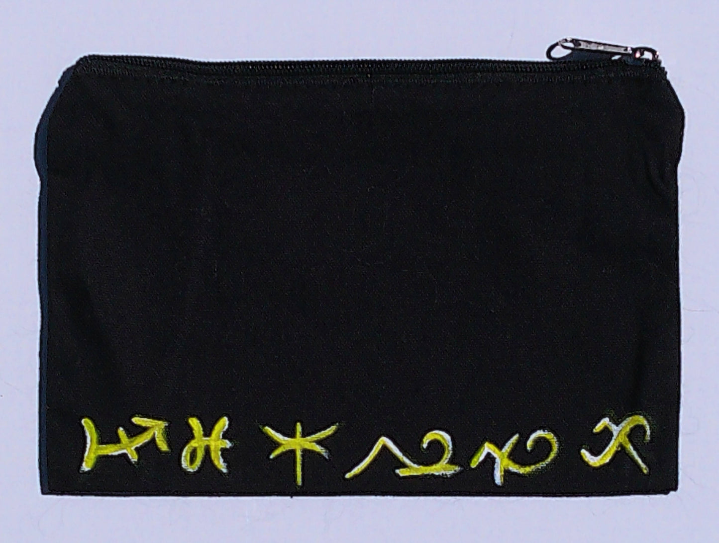 spiritual symbols on a black cancas bag and white background