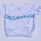 White t-shirt with blue symbols on a light gray background