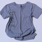 Gray t-shirt with occult symbols design on a light blue background