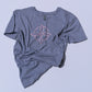 Gray t-shirt with a witches knot design on a light gray background
