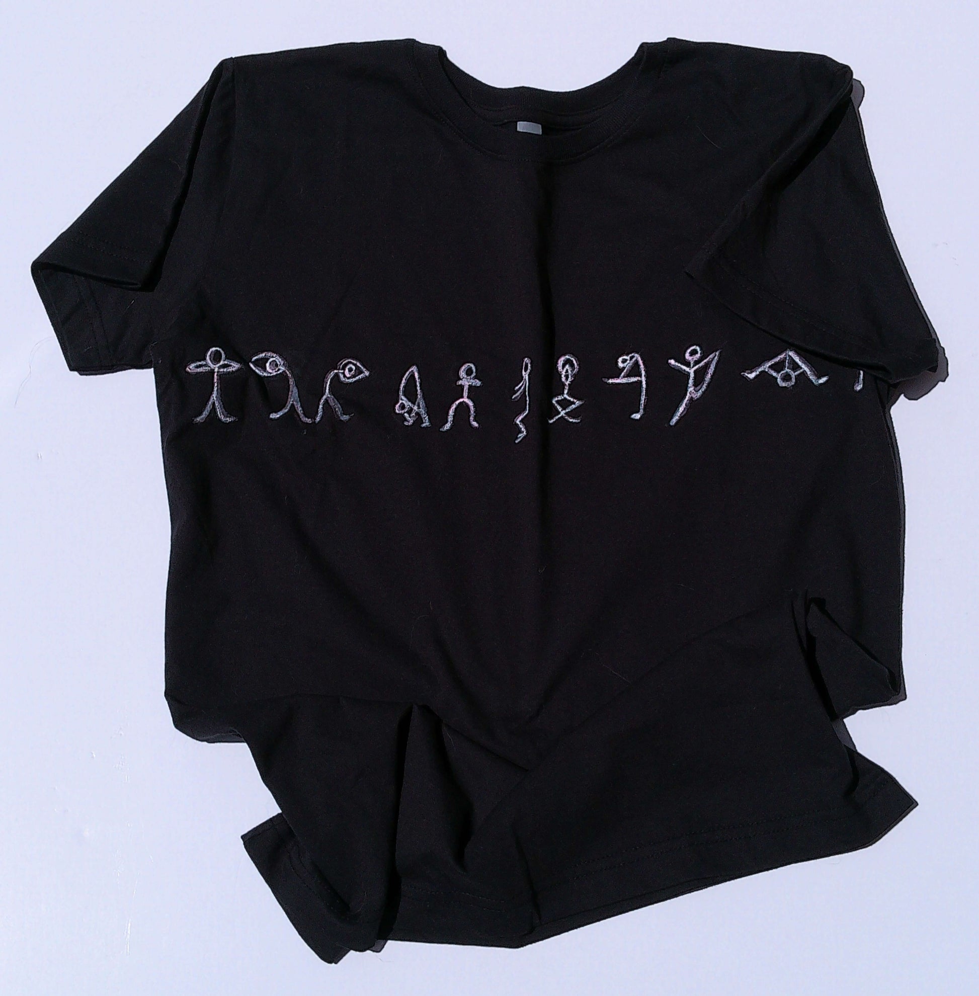 Black t-shirt with white yoga design on a light blue background