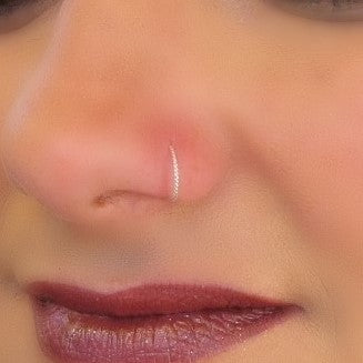 model wearing dot twist nose ring