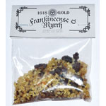 A small clear plastic bag containing a loose, irregularly shaped mixture of tan, brown, and dark brown pieces, sealed with a white header card printed with the text 'Hera Gold' and 'Grandinose & Myrtel'.