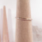thin band gold ring on mandrel