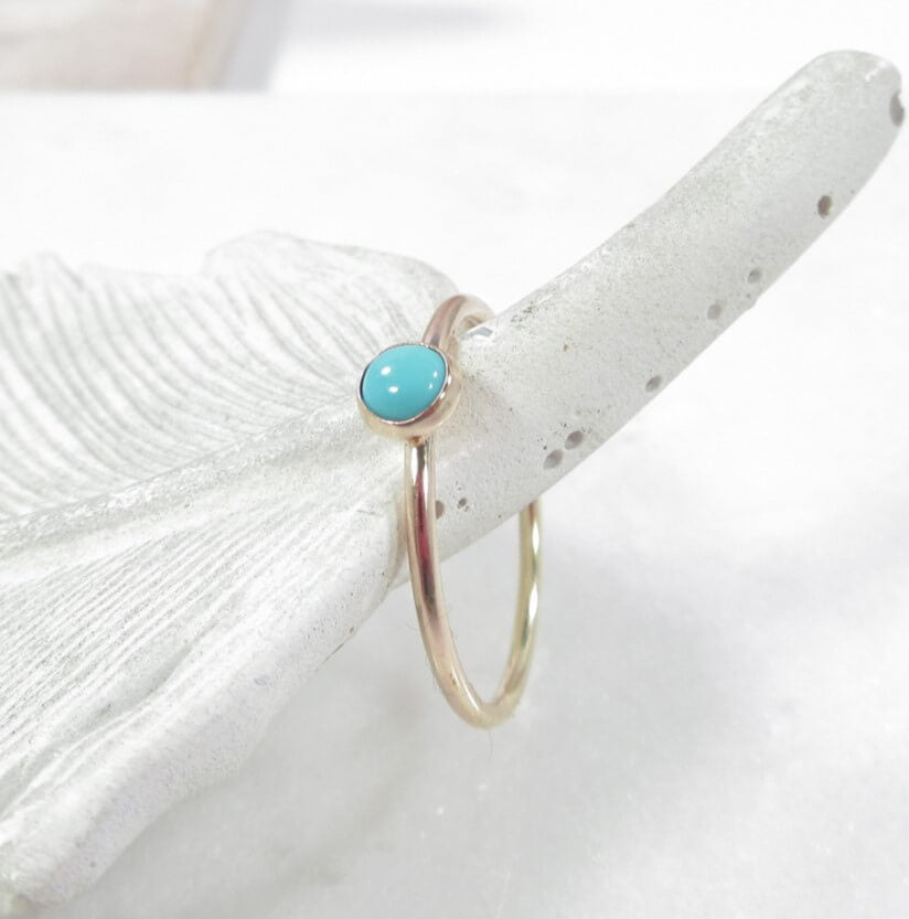 turquoise in yellow gold ring above