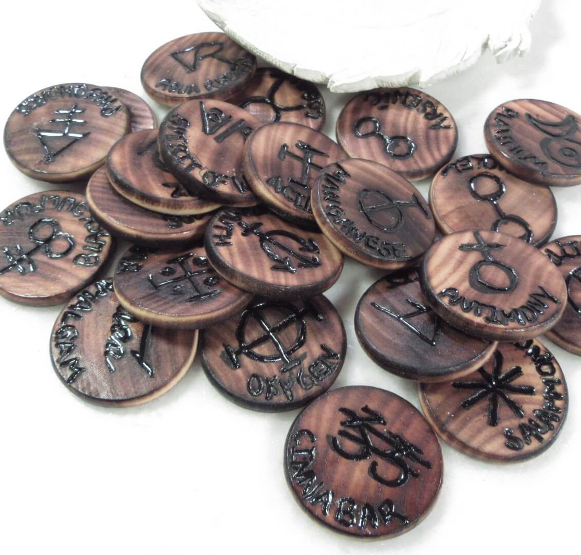 Collection of symbolism runes with engraved symbols on a white background