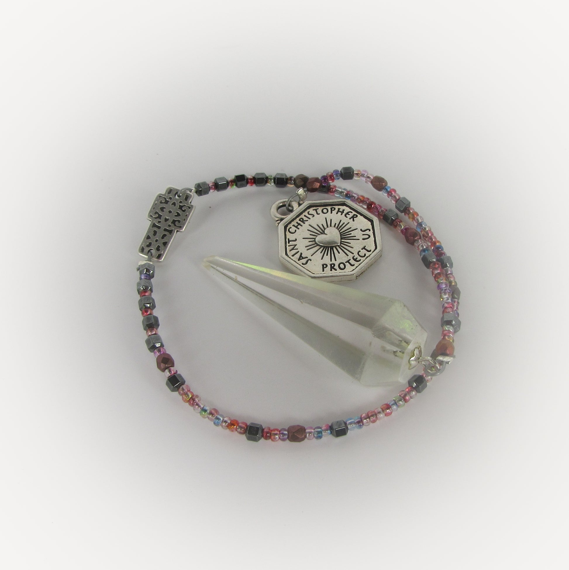 Beaded pendulum with a Saint Christopher charm on a white background
