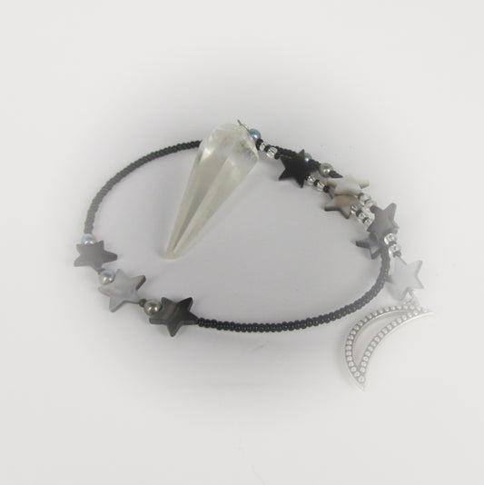 quartz crystal pendulum on white background
