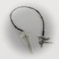 Pendulum with beaded chain, crystal pendant, and silver hummingbird charm on a white background