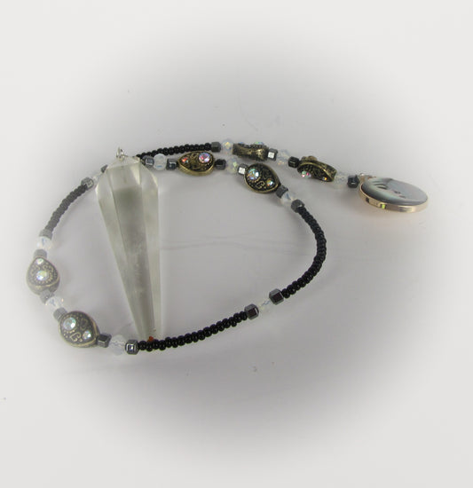 Pendulum with a man on the moon pendant on a white background