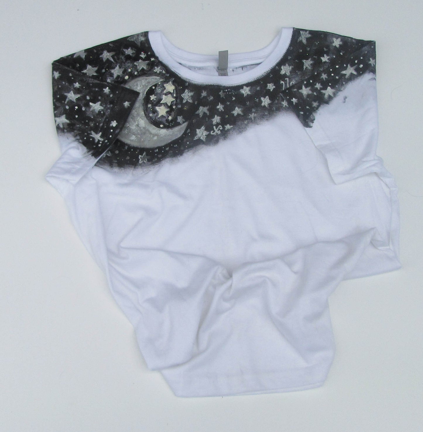 White T shirt with black starry collar on a white background