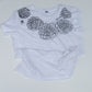 White t-shirt with black floral designs on a white background