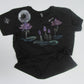 Black t-shirt with floral designs on a white background