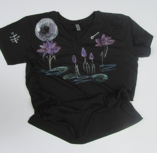 Black t-shirt with floral designs on a white background