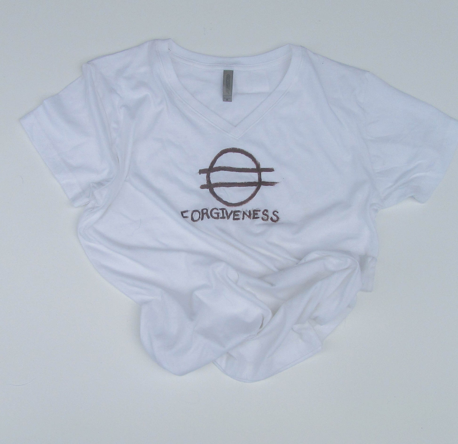 White t-shirt with a black logo and text on a light gray background