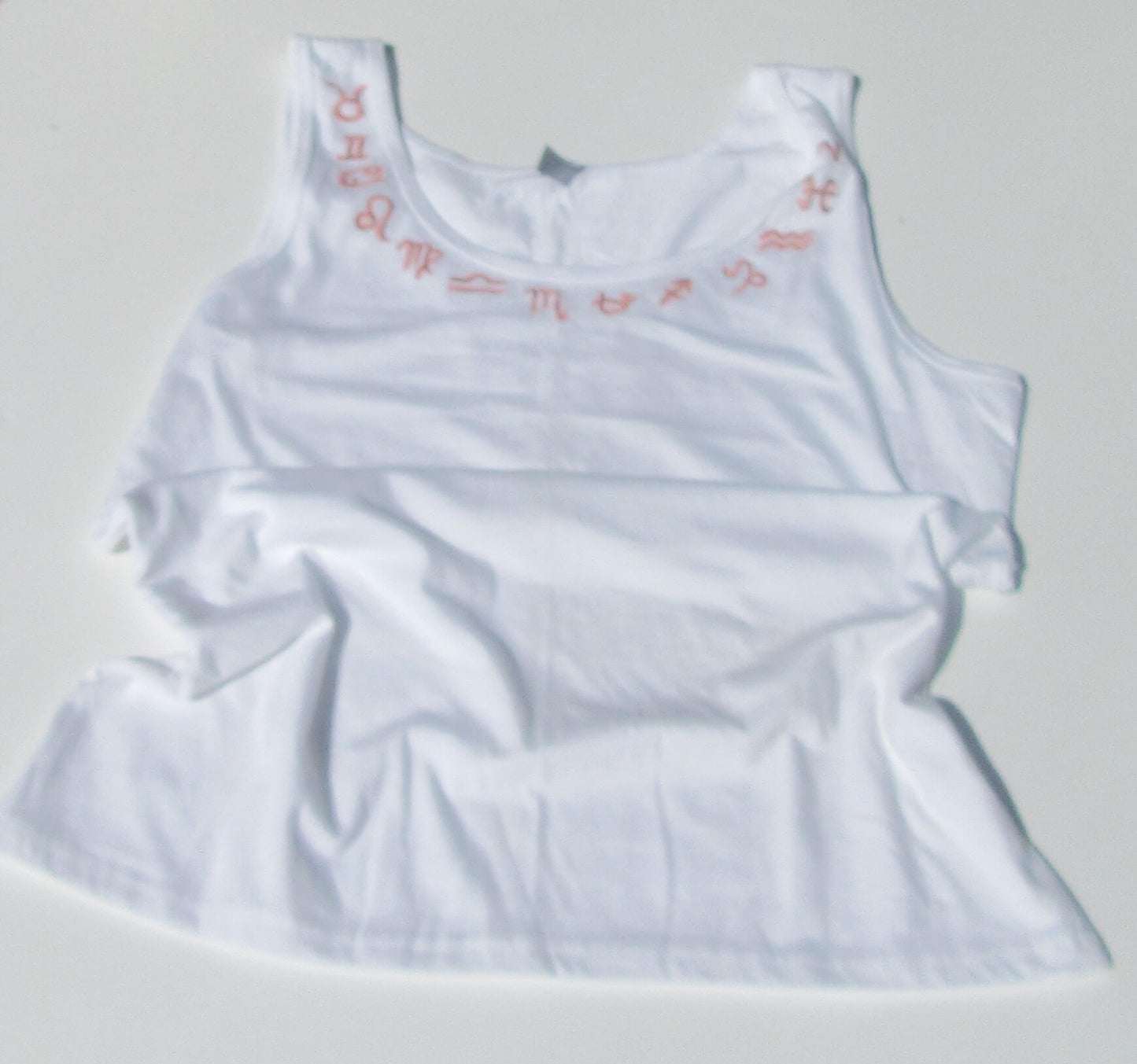 astrology signs on white tank top on a white background