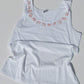 zodiac signs on a white tank top and white background