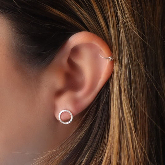model wearing 8mm hammered post earrings
