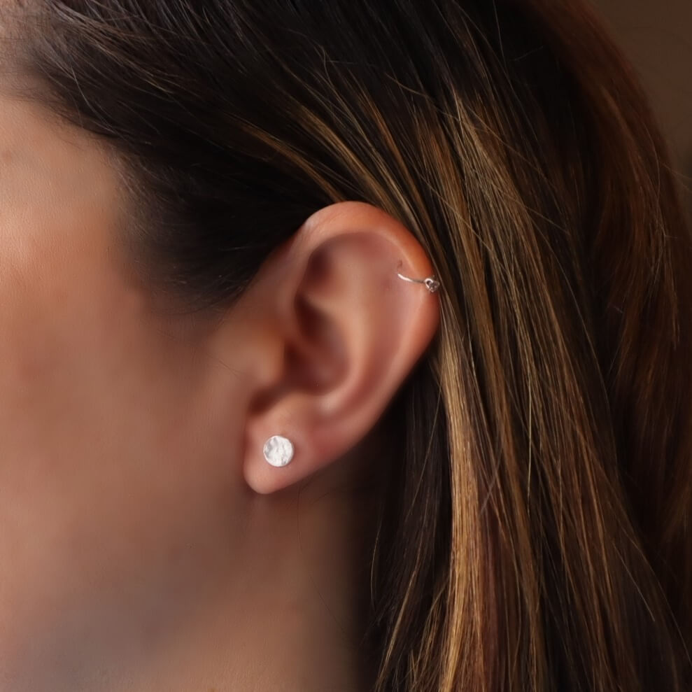 4mm dot silver post earrings on model
