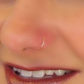 yellow gold super thin nose ring on model 
