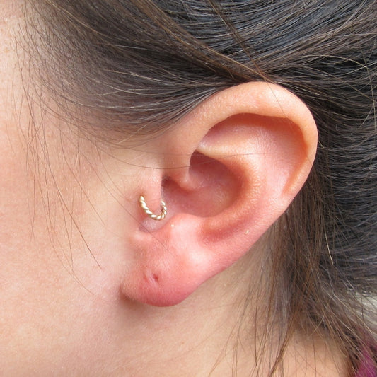 gold tragus hoop on model